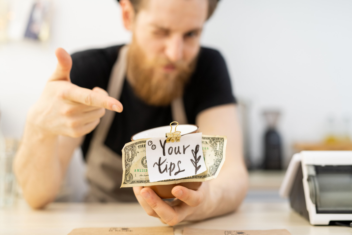 Restaurant staff reviewing tip distribution and tip pooling policy