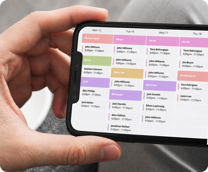 Hand holding a phone displaying the SocialSchedules shift calendar