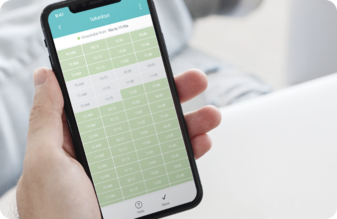 Hand holding a phone showing the availability and time off request screen
