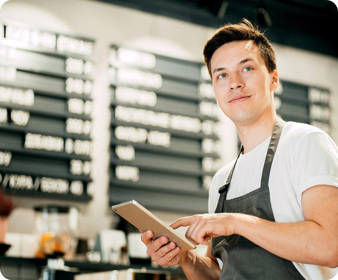 Manager reviewing payroll data on a tablet